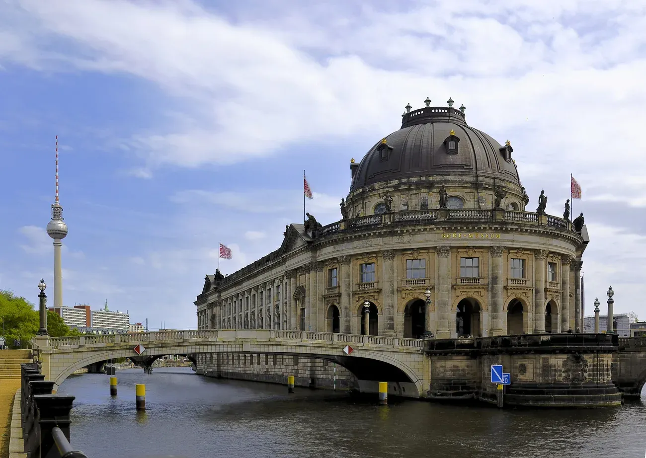 Bode Museum in Berlin seen across the Spree on a clear day, with the TV Tower behind it