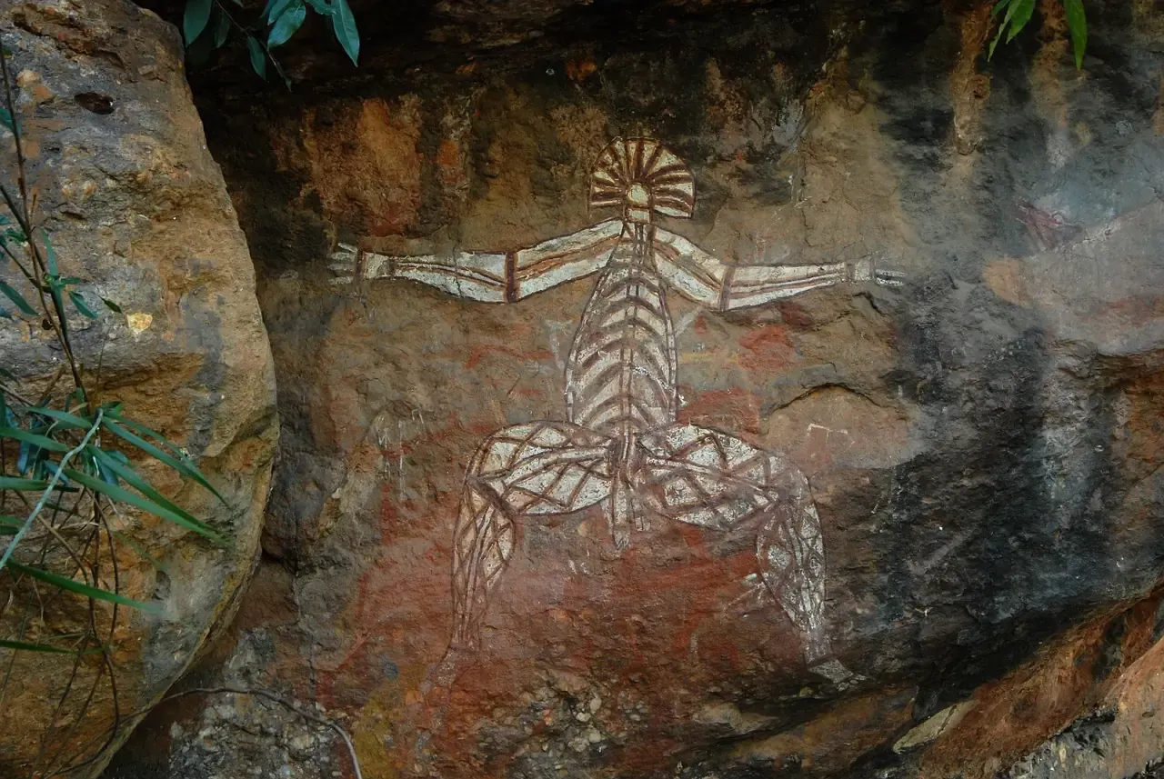 Ochre rock art painted on a sandstone shelter wall in Kakadu National Park