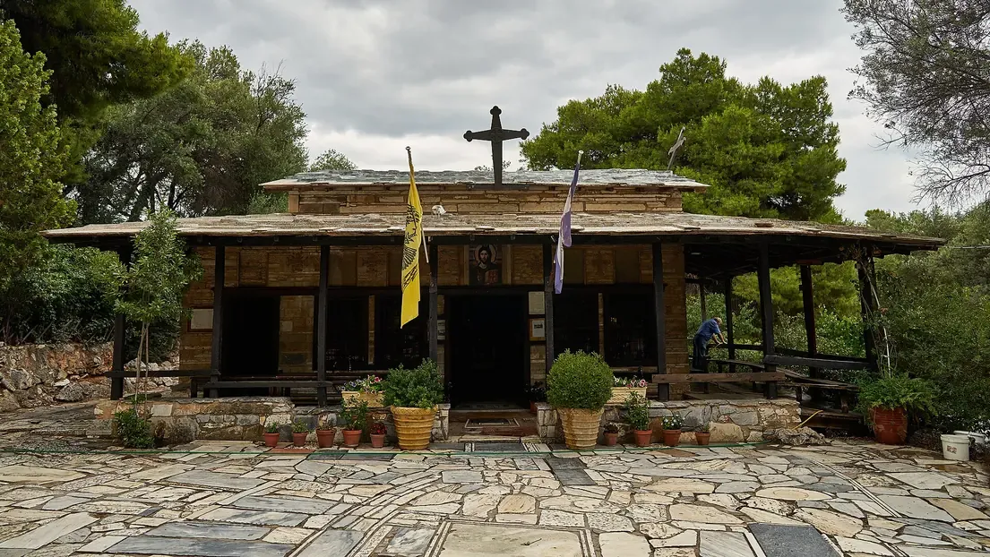 The wood roofed Byzantine chapel of Agios Dimitrios Loumbardiaris among pines on Philopappos hill, Athens