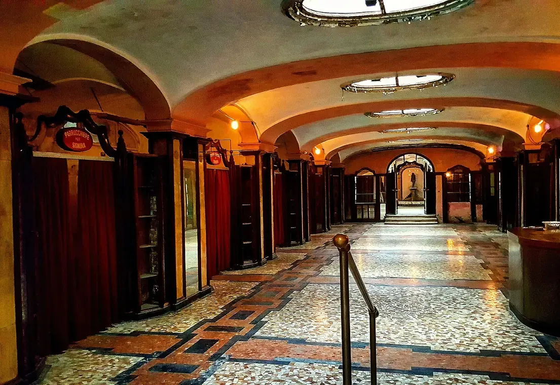 Art Deco underground atrium with mosaic floor and oval skylights at the Albergo Diurno Venezia in Milan