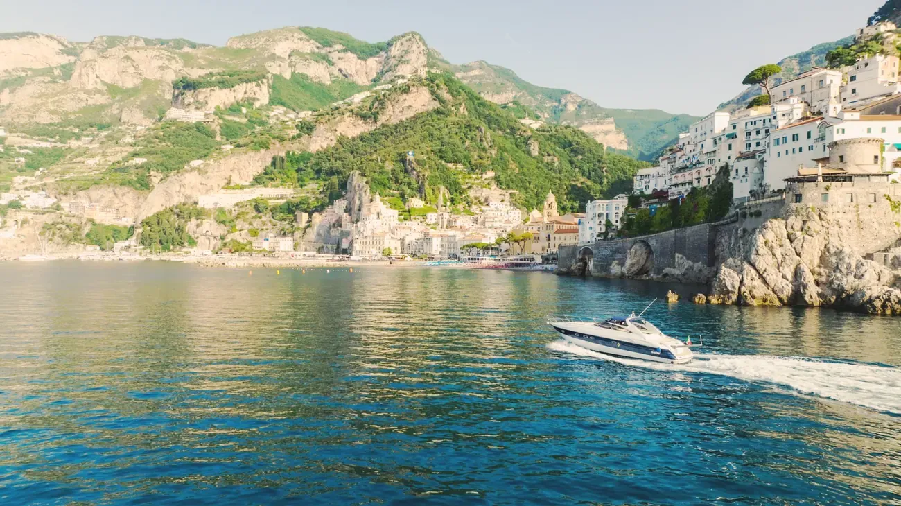 Boat crossing the waters off the Amalfi Coast, Italy