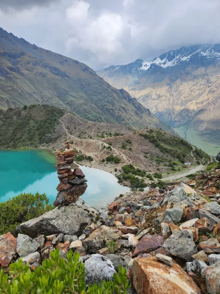 A turquoise Andean lagoon among rocky mountains near Cusco, Peru