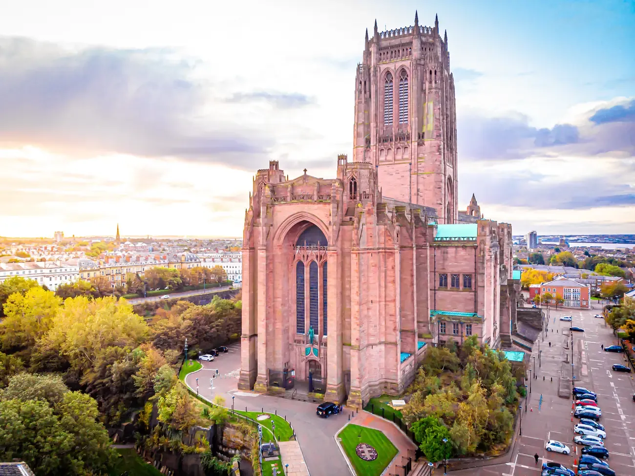 Aerial view of the red sandstone Liverpool Cathedral and its central tower in morning light