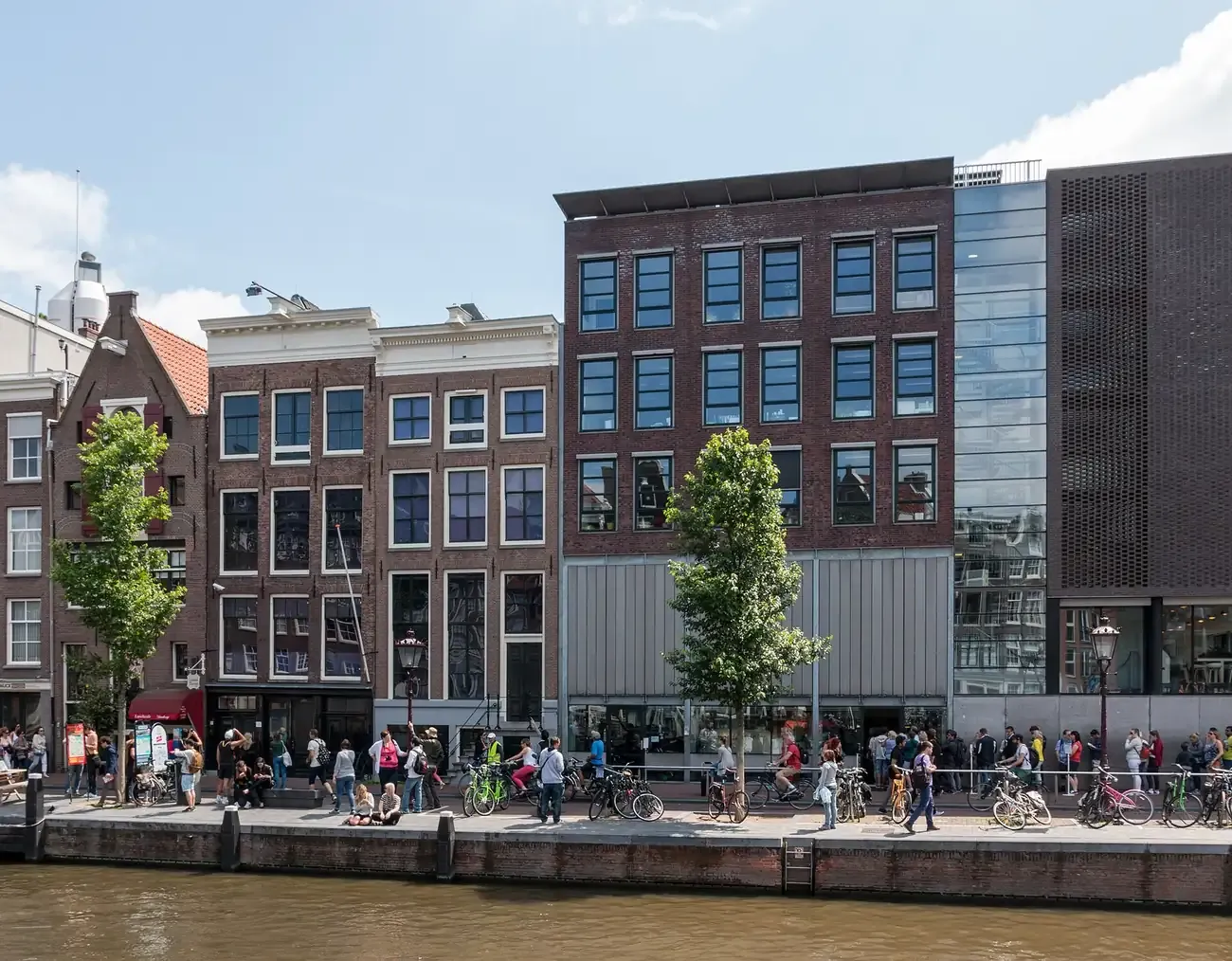 The Anne Frank House and its modern museum wing seen across the Prinsengracht canal in Amsterdam