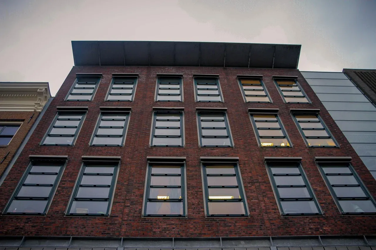 The brick and glass entrance wing of the Anne Frank House museum on Westermarkt in Amsterdam