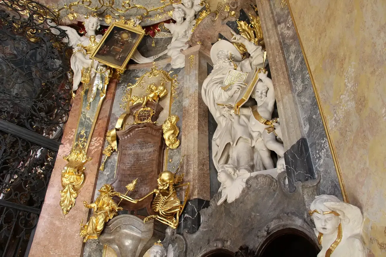 The gilded Rococo high altar and stucco figures inside the Asamkirche in Munich