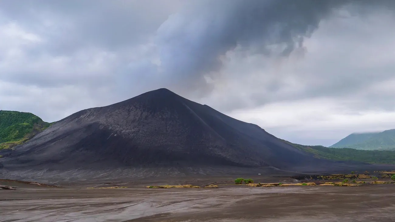 A grey ash cloud rising from the summit of Mount Yasur on Tanna, Vanuatu