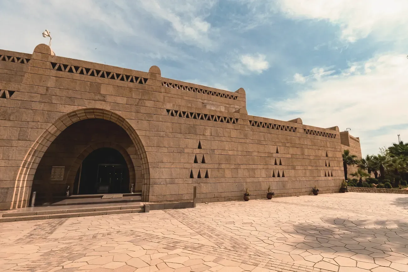 Sandstone facade and arched entrance of the Nubian Museum in Aswan