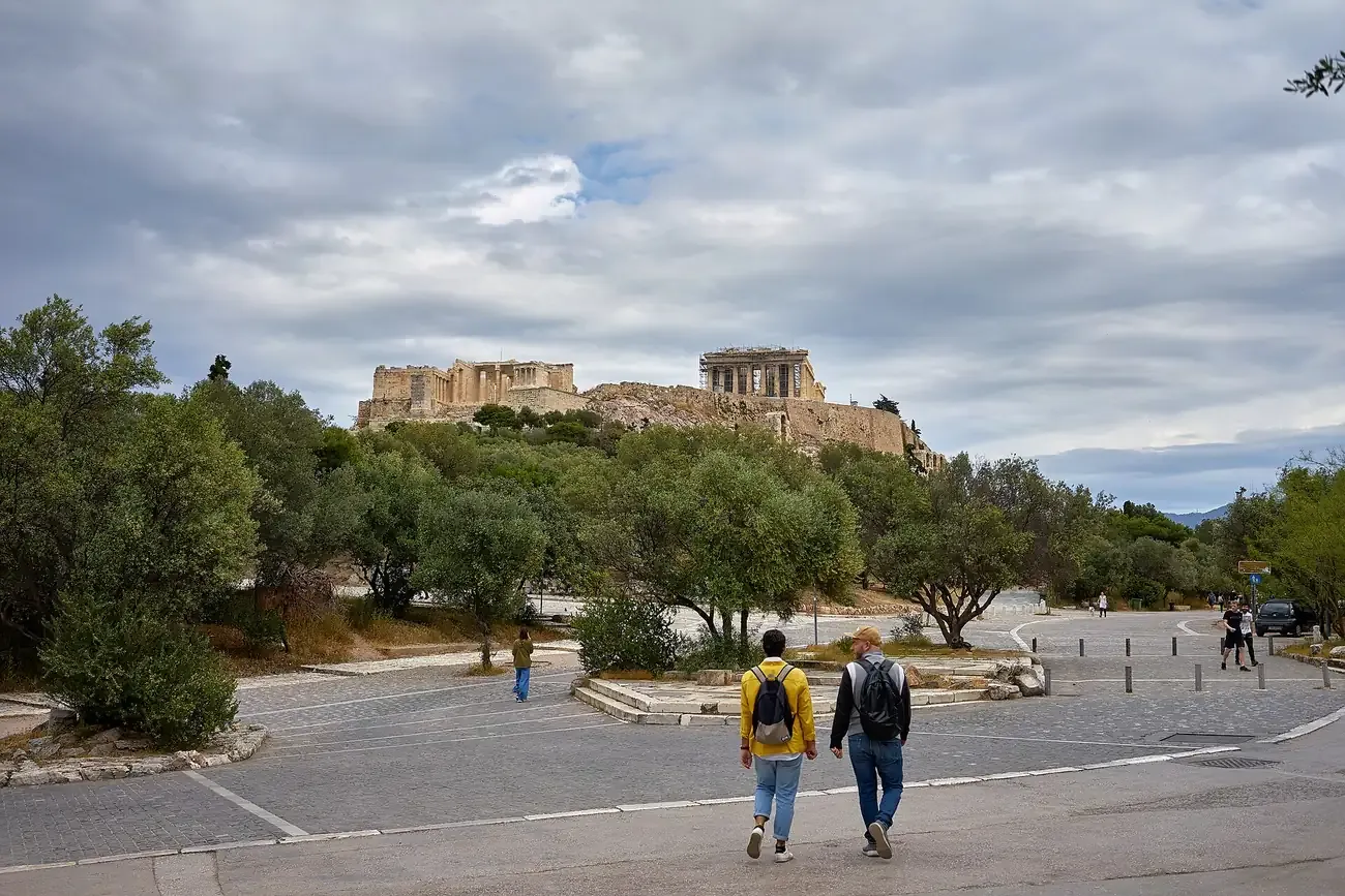 Walkers on the Dionysiou Areopagitou pedestrian street below the Acropolis, Athens