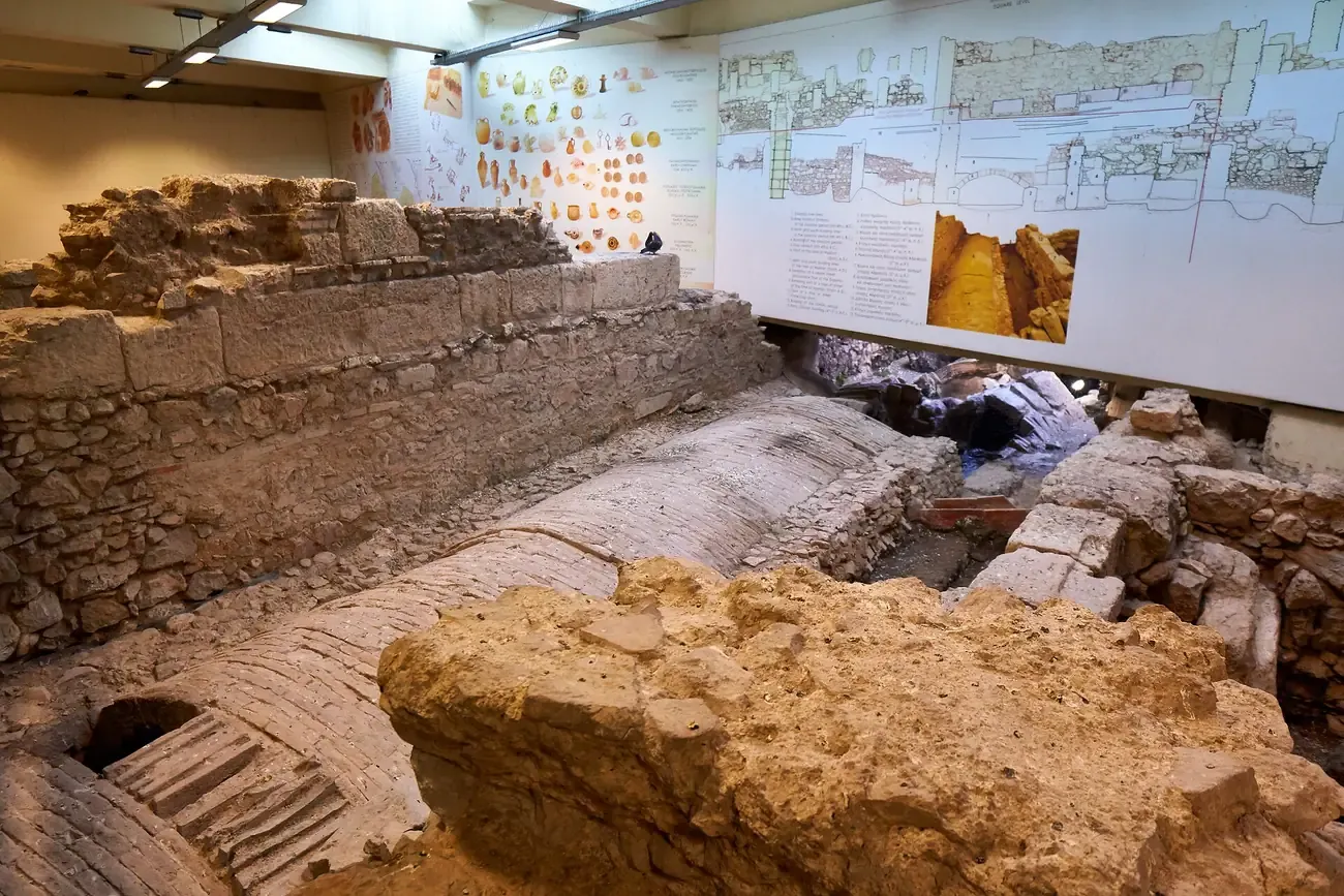 The vaulted Eridanos riverbed and ancient walls exposed inside Monastiraki metro station in Athens