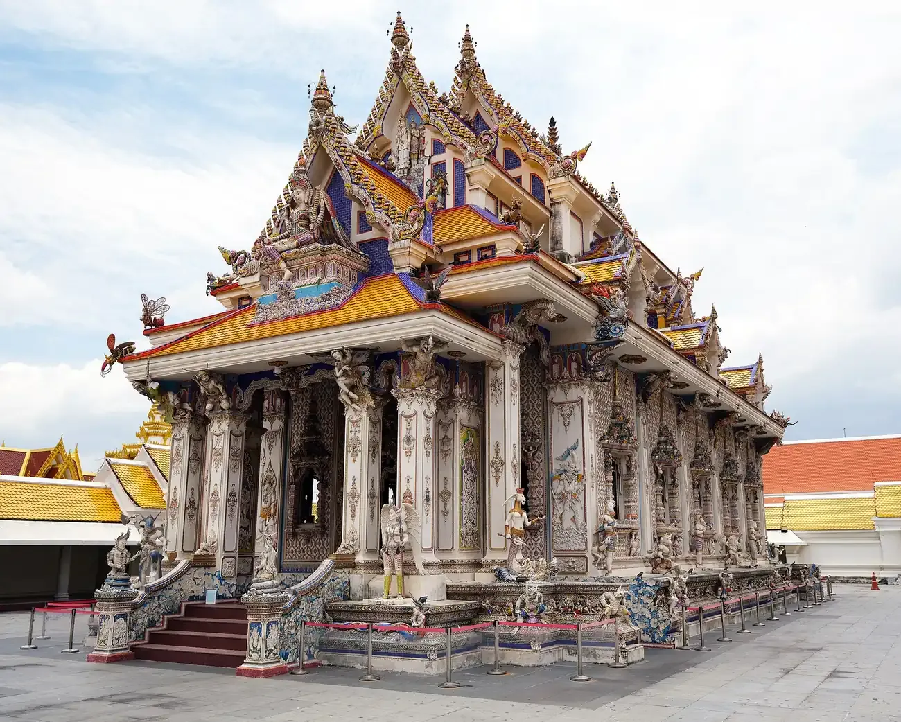 The heavily sculpted ubosot of Wat Pariwat in Yan Nawa, Bangkok