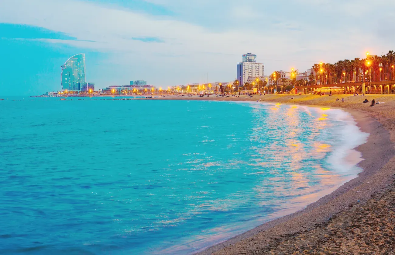 Barceloneta beach at dusk with the W hotel in Barcelona