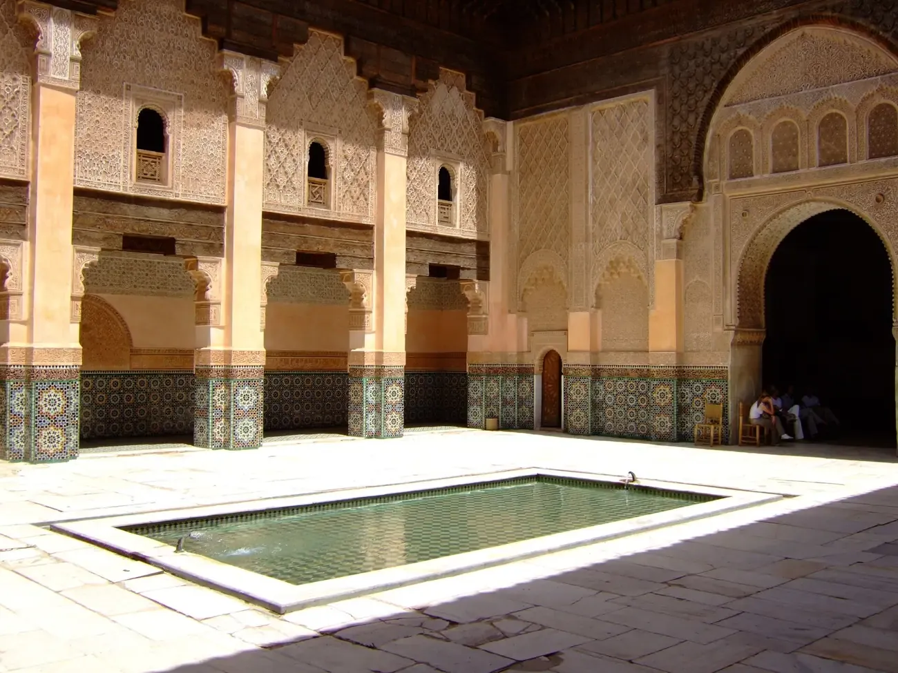 The central courtyard and reflecting pool of the Ben Youssef Madrasa in Marrakech