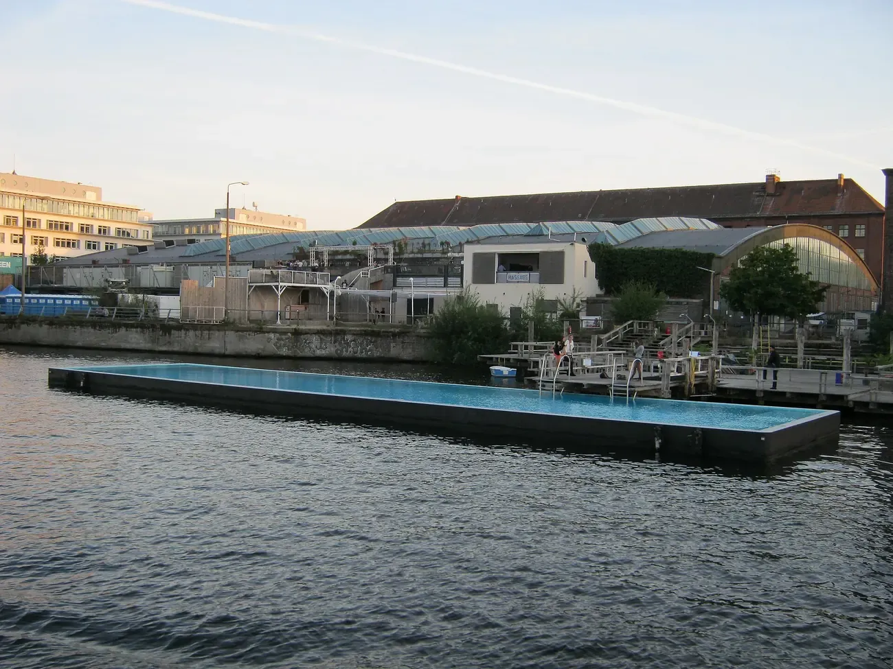 The Badeschiff floating swimming pool moored in the Spree river in Berlin