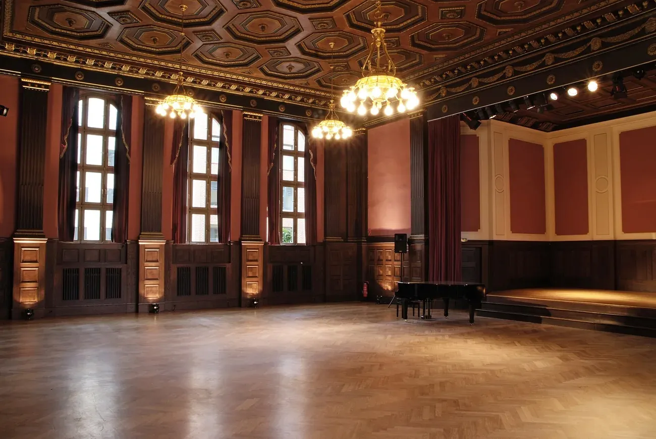 The ornate ceiling and empty parquet floor of the Meistersaal recording hall at Hansa Studios in Berlin