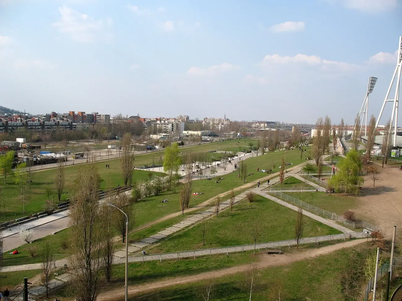 Aerial view over Mauerpark in Berlin with its diagonal paths and the city skyline in the background