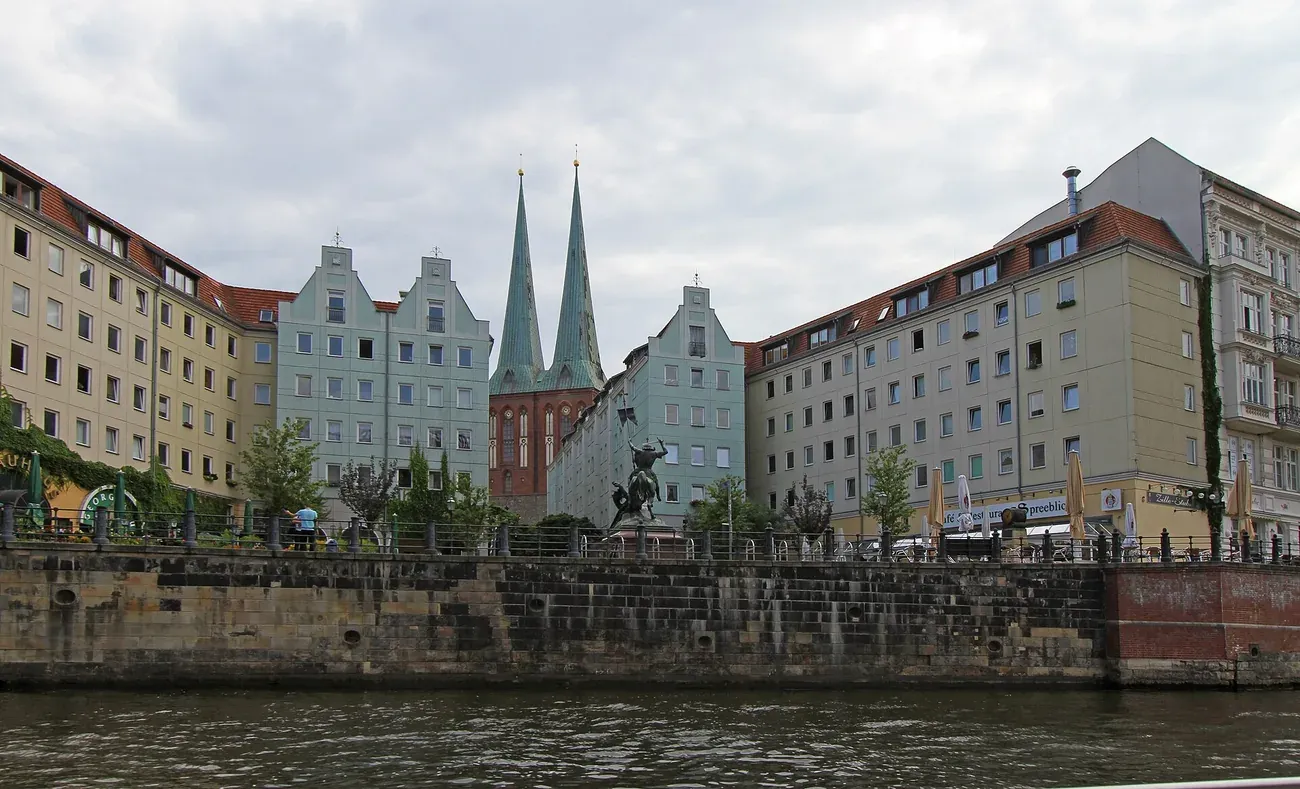 The twin spires of the Nikolaikirche rising above the reconstructed gabled houses of the Nikolaiviertel in Berlin