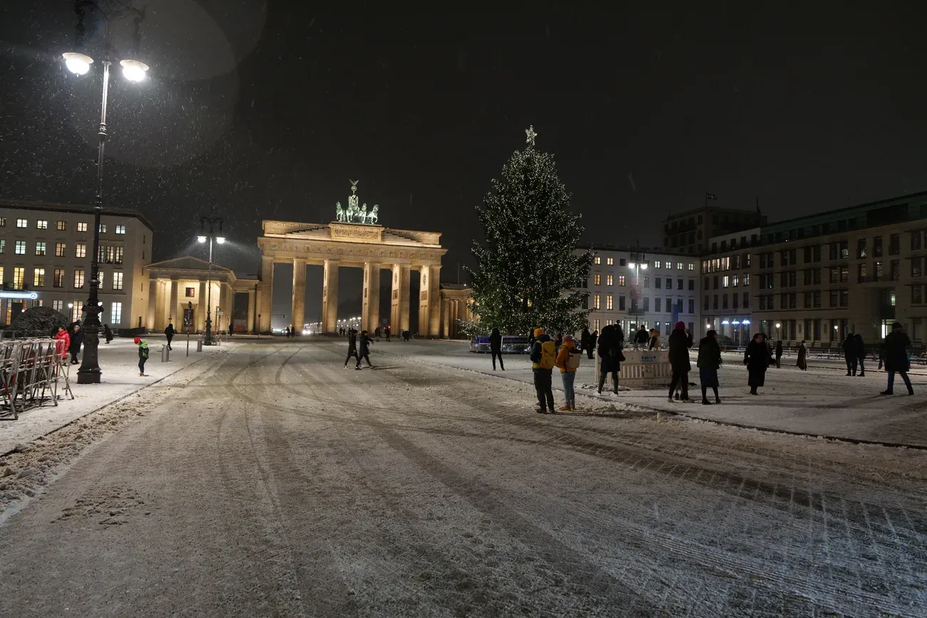 The Christmas tree on Pariser Platz beside the Brandenburg Gate in Berlin on a snowy night