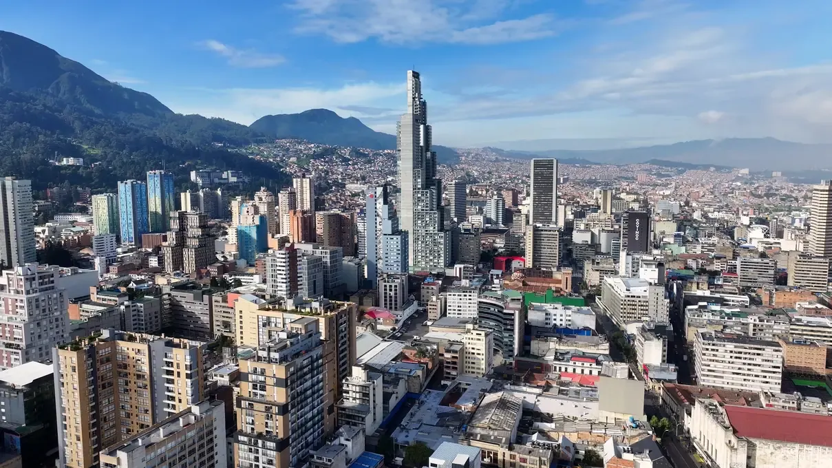 The Bogota skyline with a tall tower against the Andes