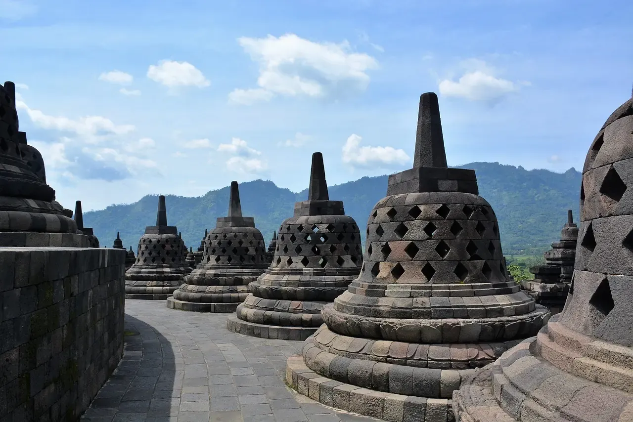 The perforated stone stupas on the upper terraces of Borobudur temple in Central Java