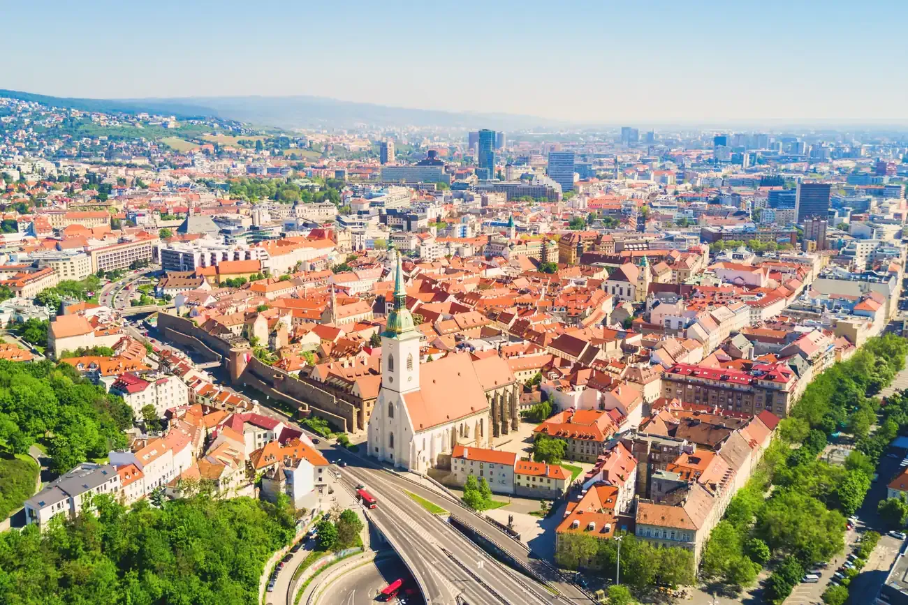 Aerial panoramic view of Bratislava's old town with St. Martin's Cathedral and the city skyline beyond