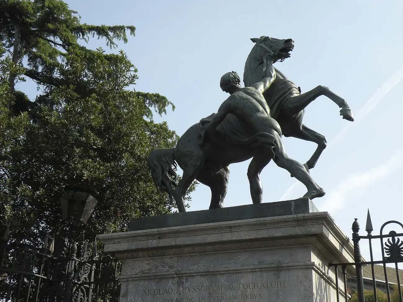 One of the bronze horse-tamer groups by Peter Clodt on a pedestal by the Royal Palace gates in Naples