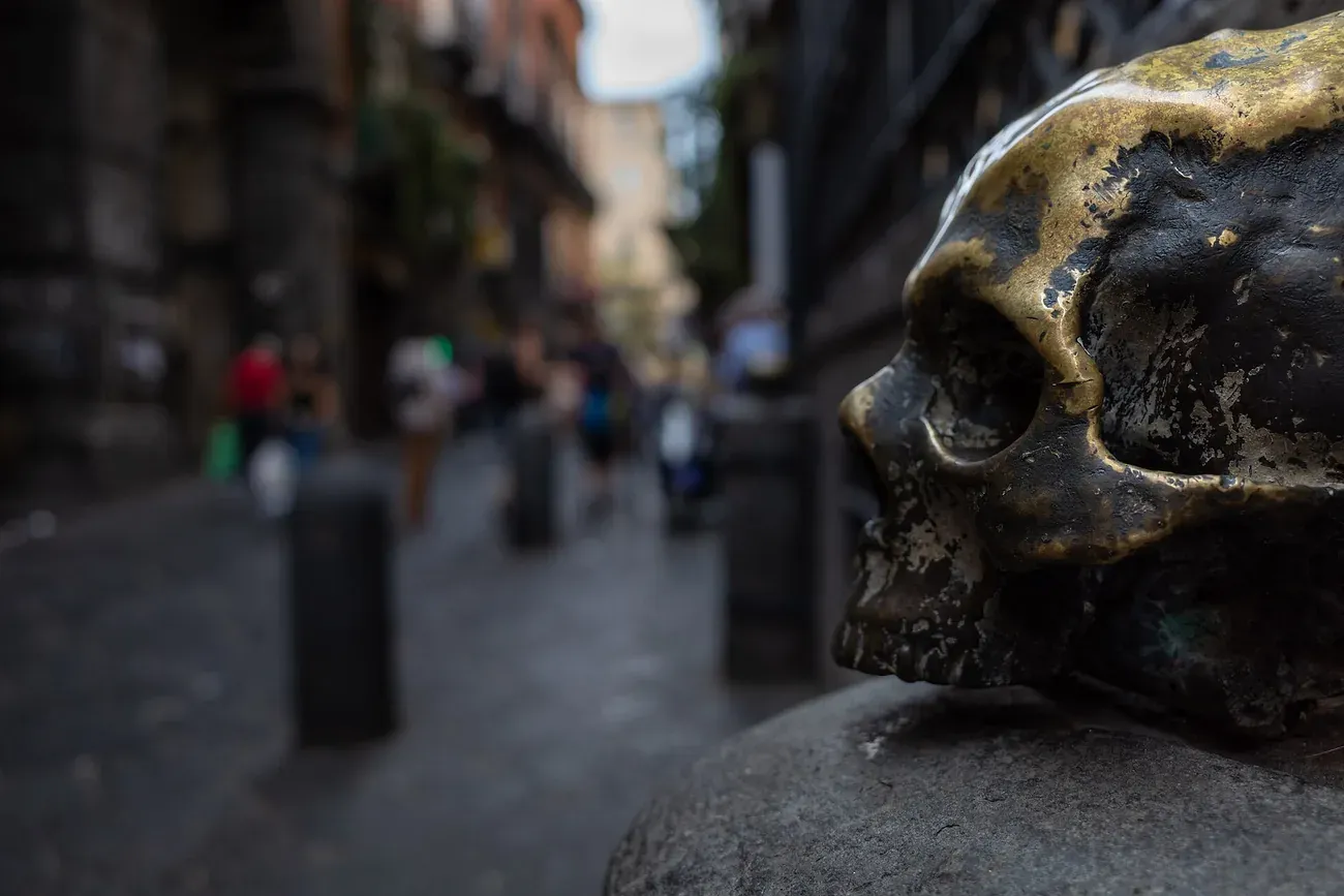 Bronze skull at the entrance of the church of Santa Maria delle Anime del Purgatorio ad Arco on a Naples street