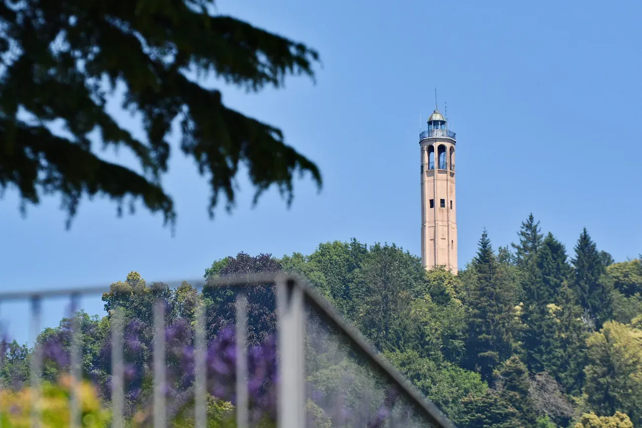 The Faro Voltiano lighthouse tower in Brunate seen from Parco Volta