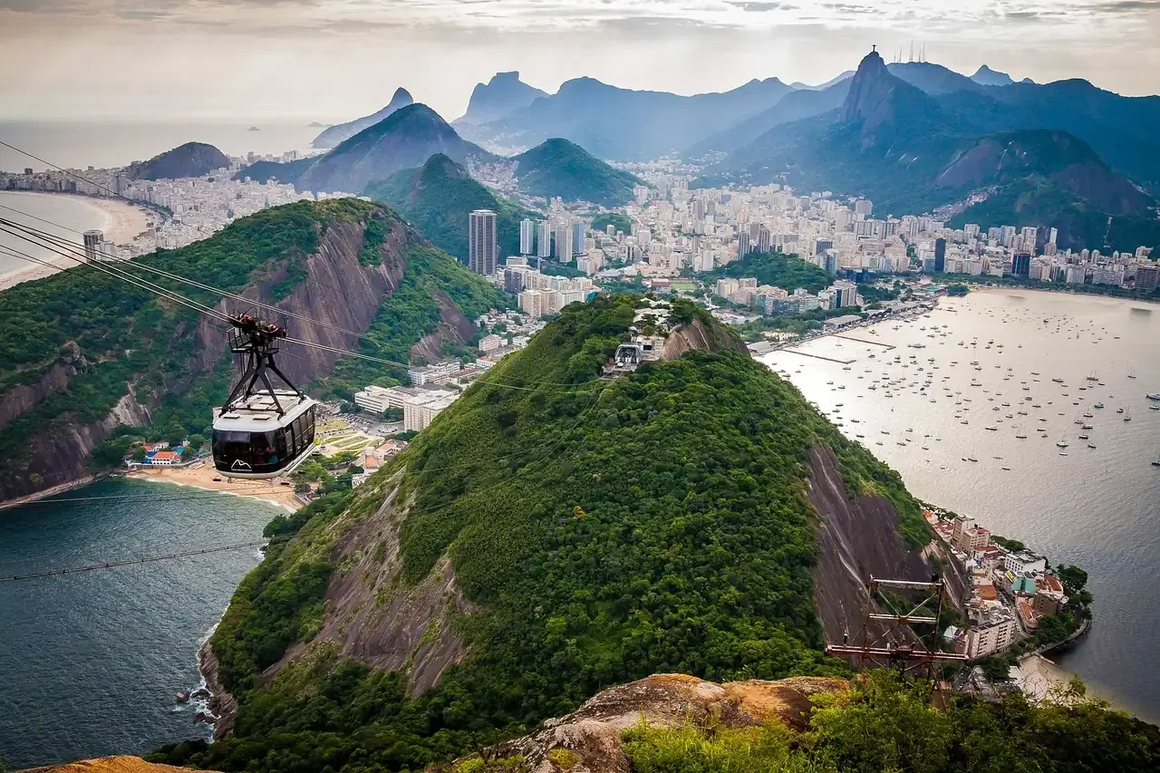 A cable car crossing above Urca hill and Botafogo bay in Rio de Janeiro