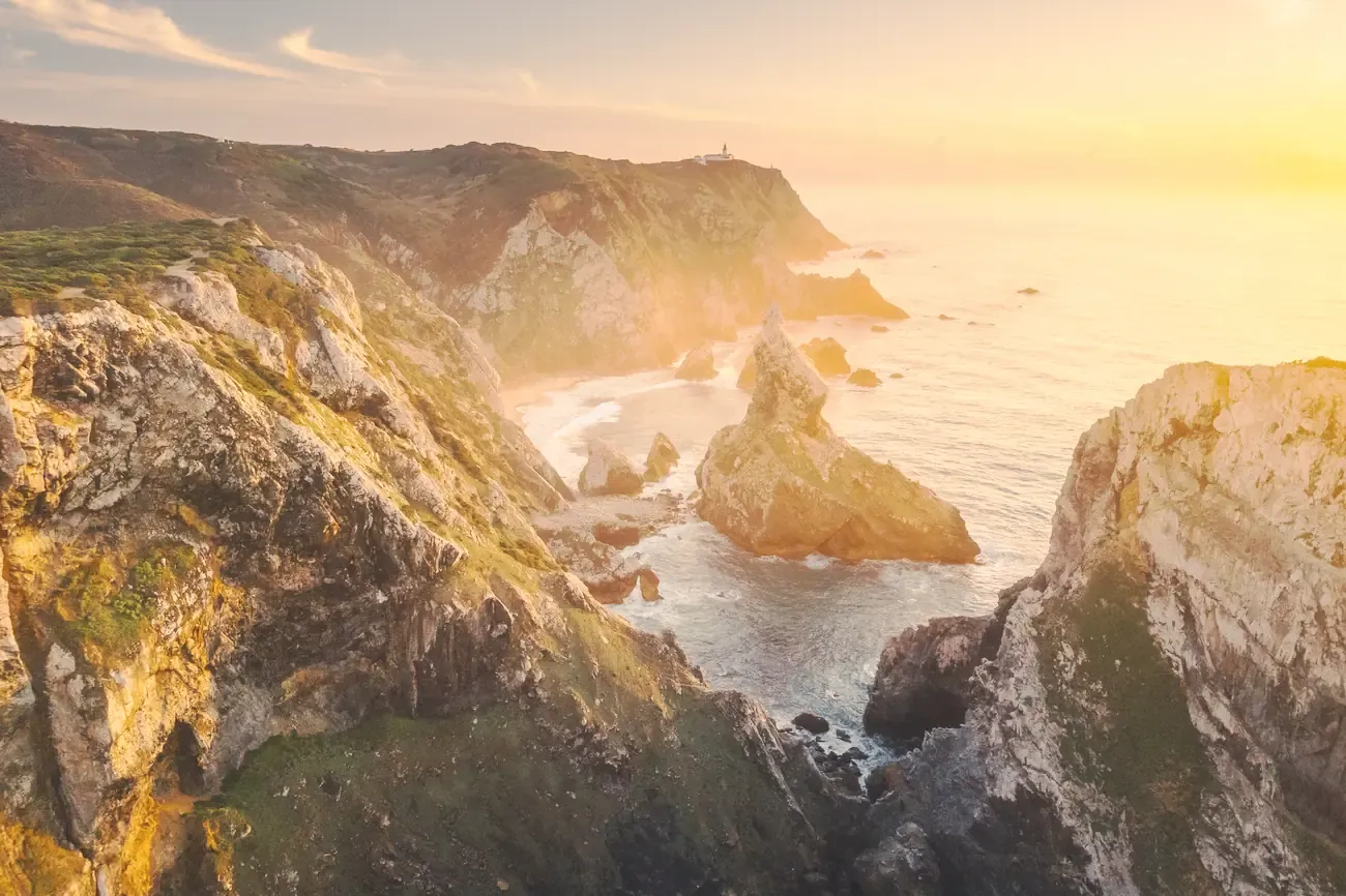 Cliffs and sea stacks on the Atlantic coast at Cabo da Roca at sunset, near Sintra