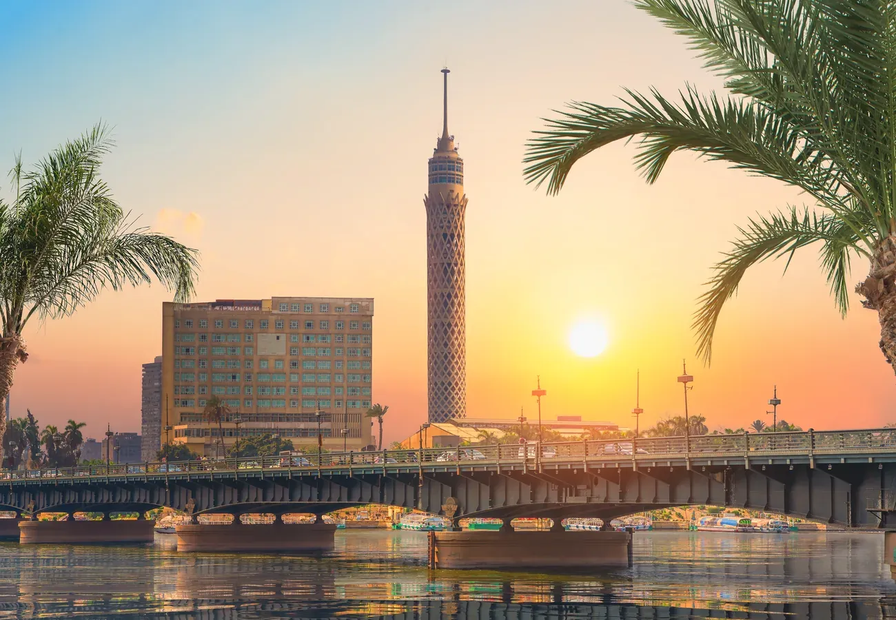 The Nile and the Cairo skyline with the Cairo Tower at dusk