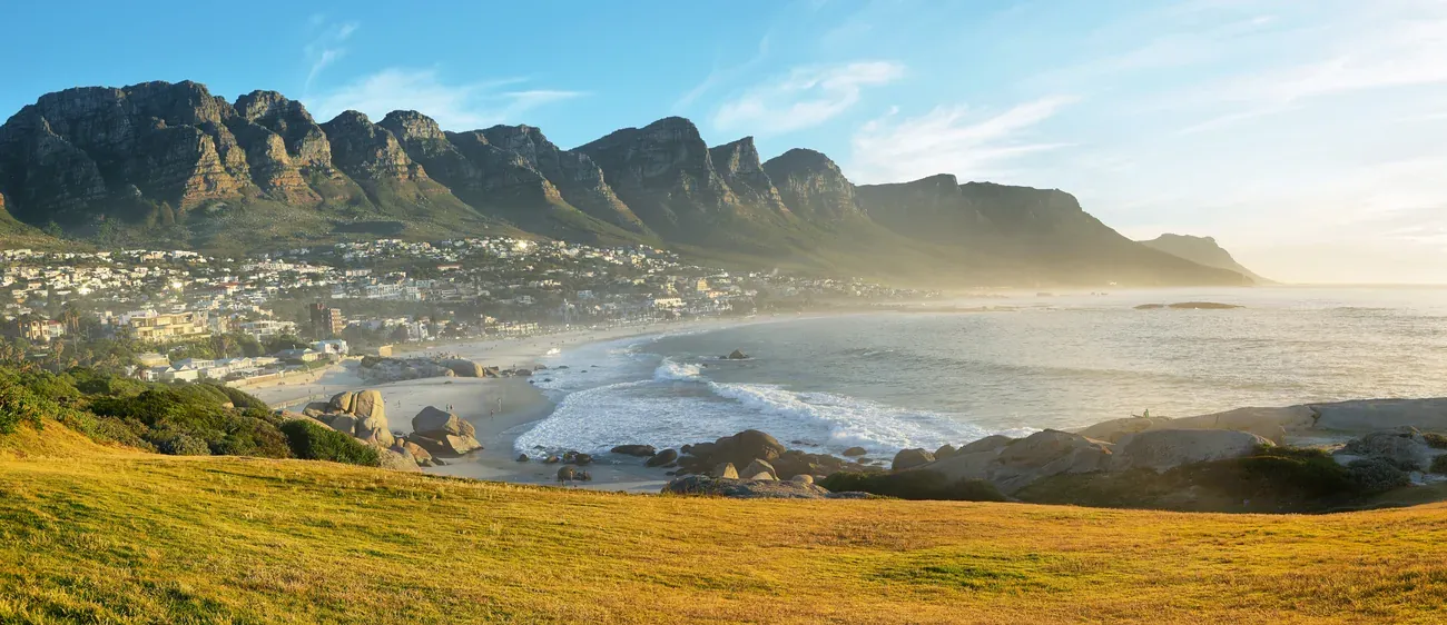 Panorama of Camps Bay and the Twelve Apostles at golden hour, Cape Town