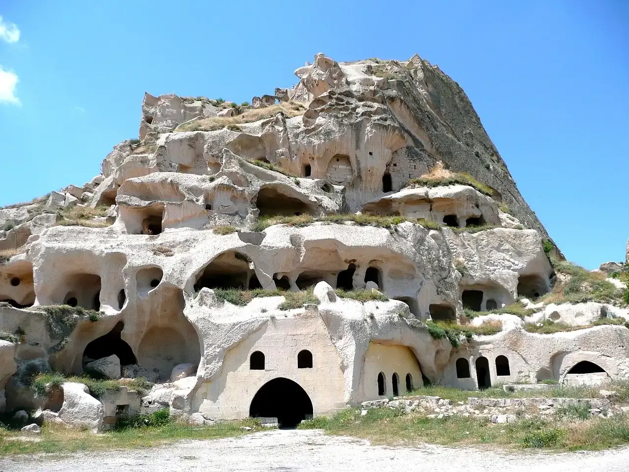 Rock-cut dwellings carved into the Uchisar outcrop in Cappadocia