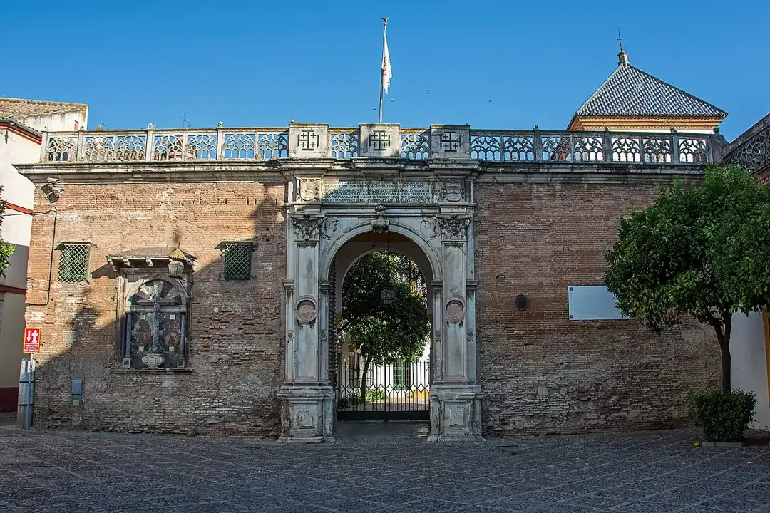 The marble gateway and brick facade of the Casa de Pilatos in Seville