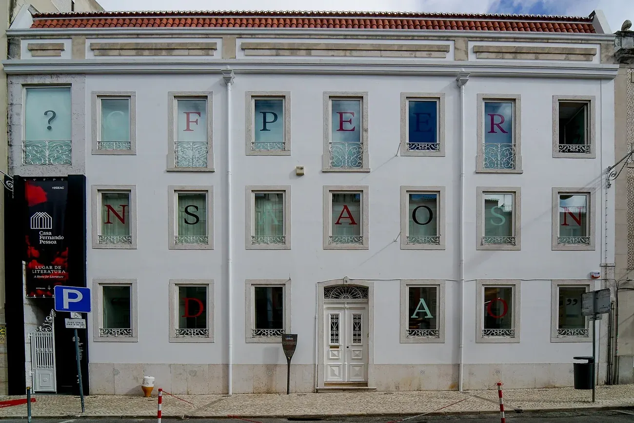The white facade of Casa Fernando Pessoa, the poet's last home, in the Campo de Ourique neighborhood of Lisbon
