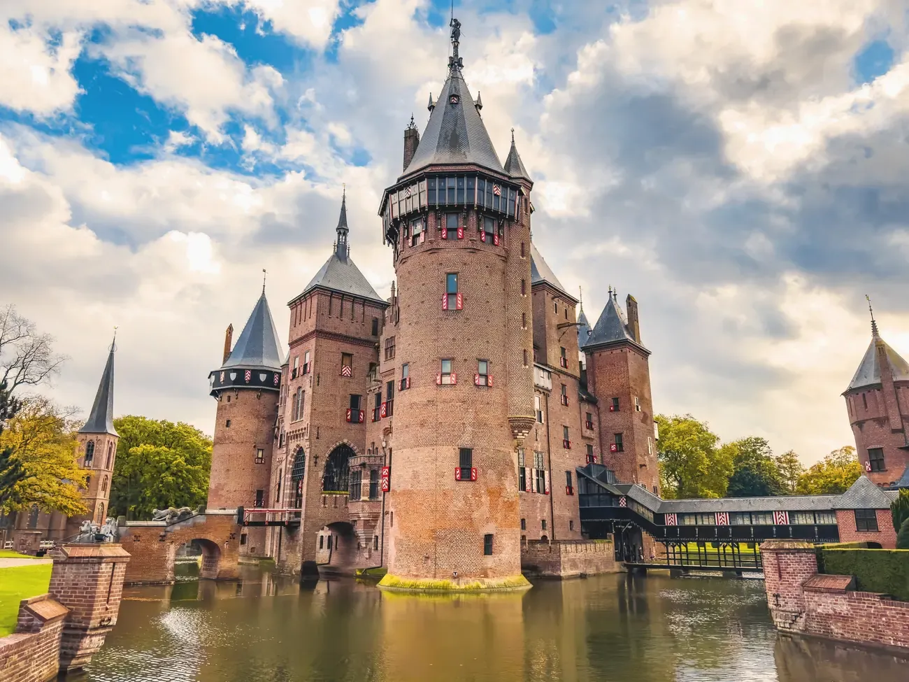 The towers of Castle de Haar reflected in its moat, Utrecht, Netherlands