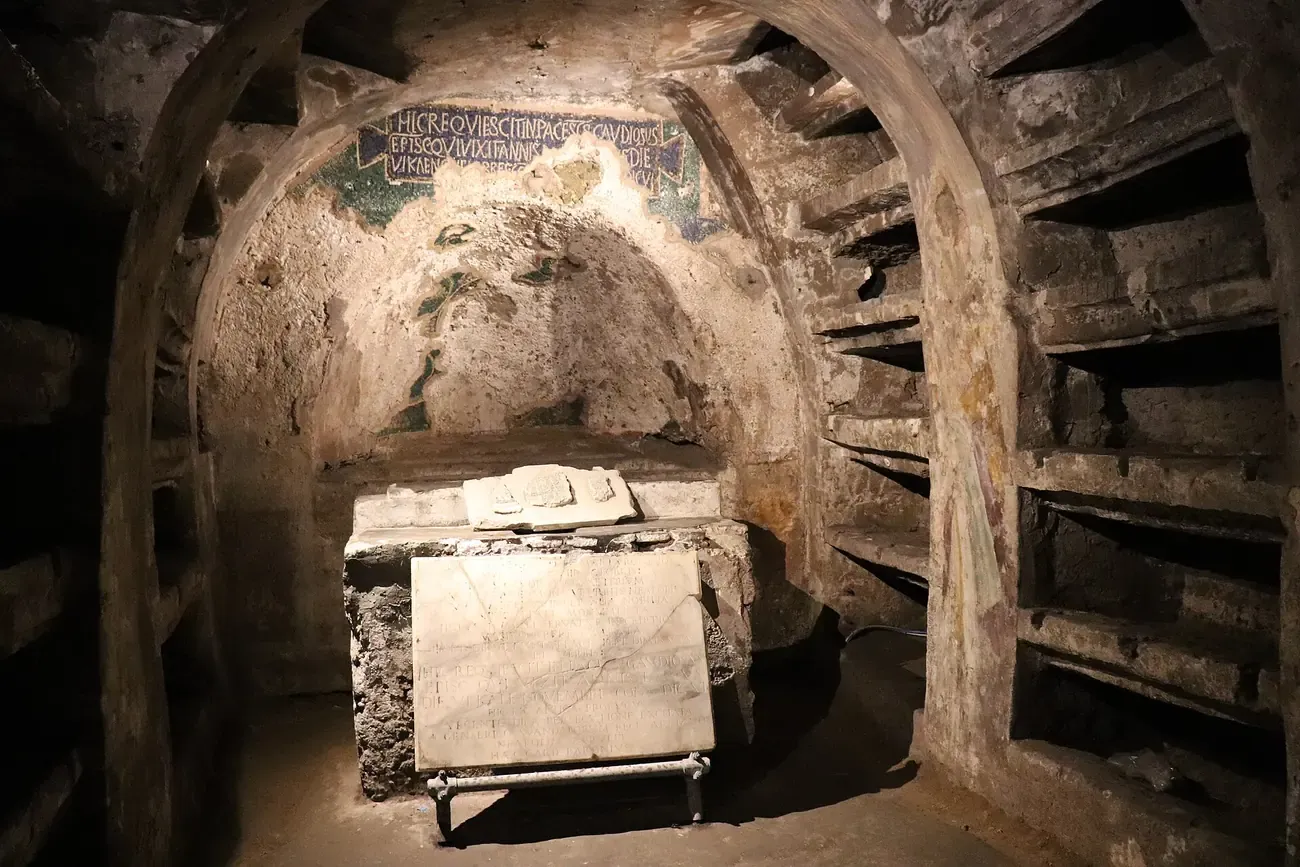 Burial niches and the mosaic epitaph of Bishop Gaudiosus inside the Catacombs of San Gaudioso in Naples