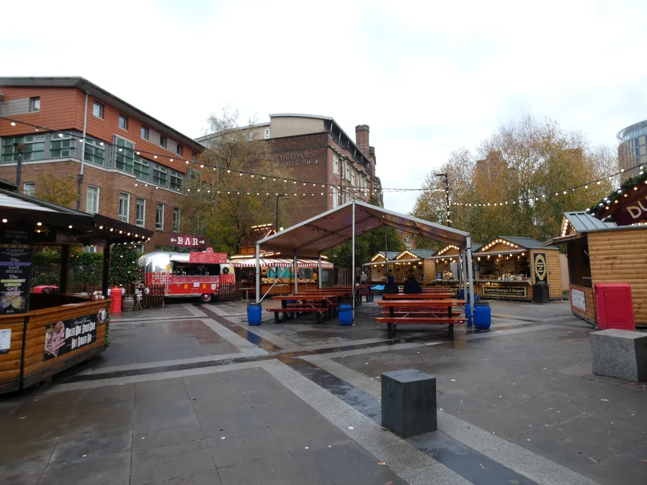 Christmas market chalets and a bar in Cathedral Gardens, Manchester