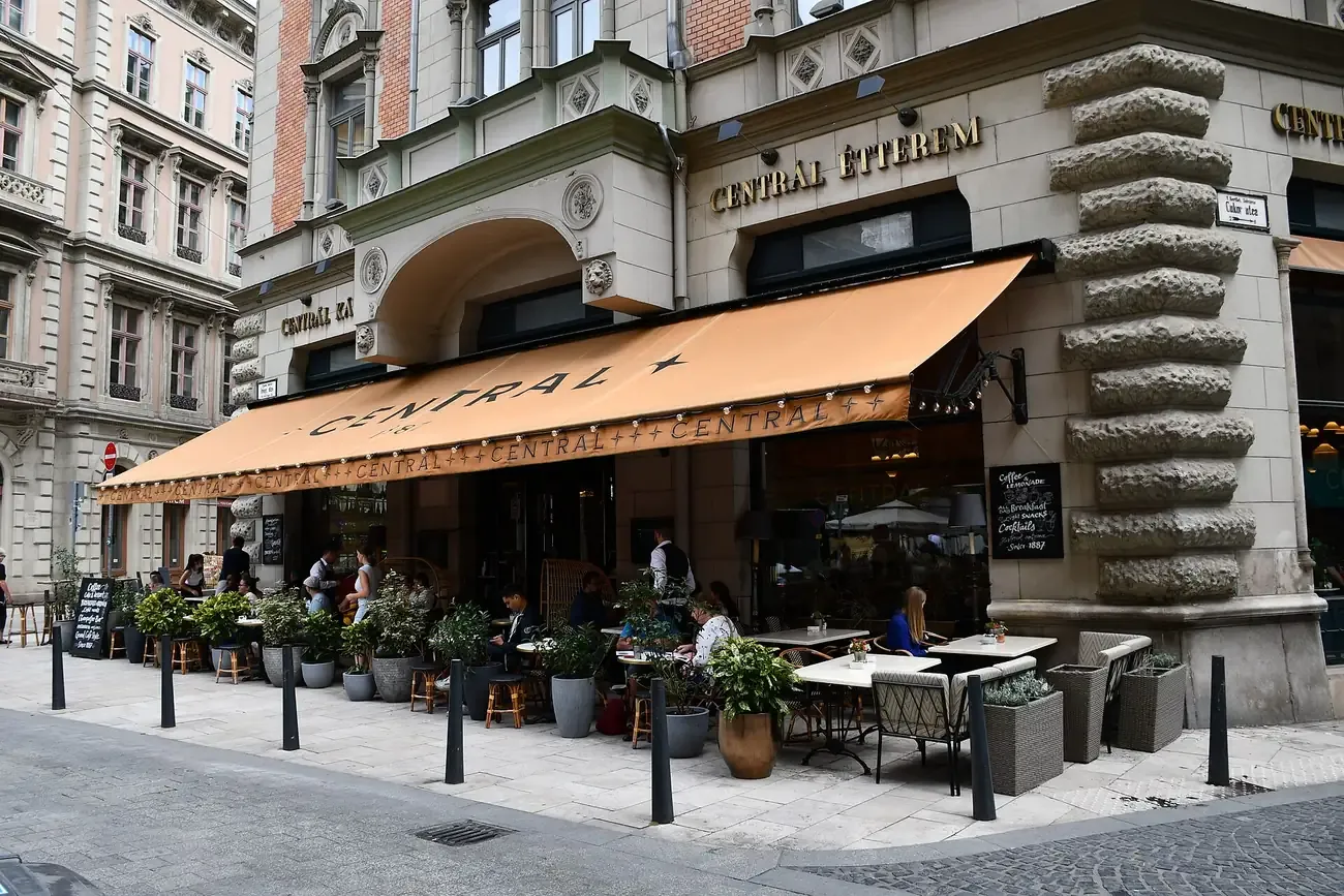 The corner facade and awning of the Central Cafe and Restaurant on Karolyi utca in Budapest