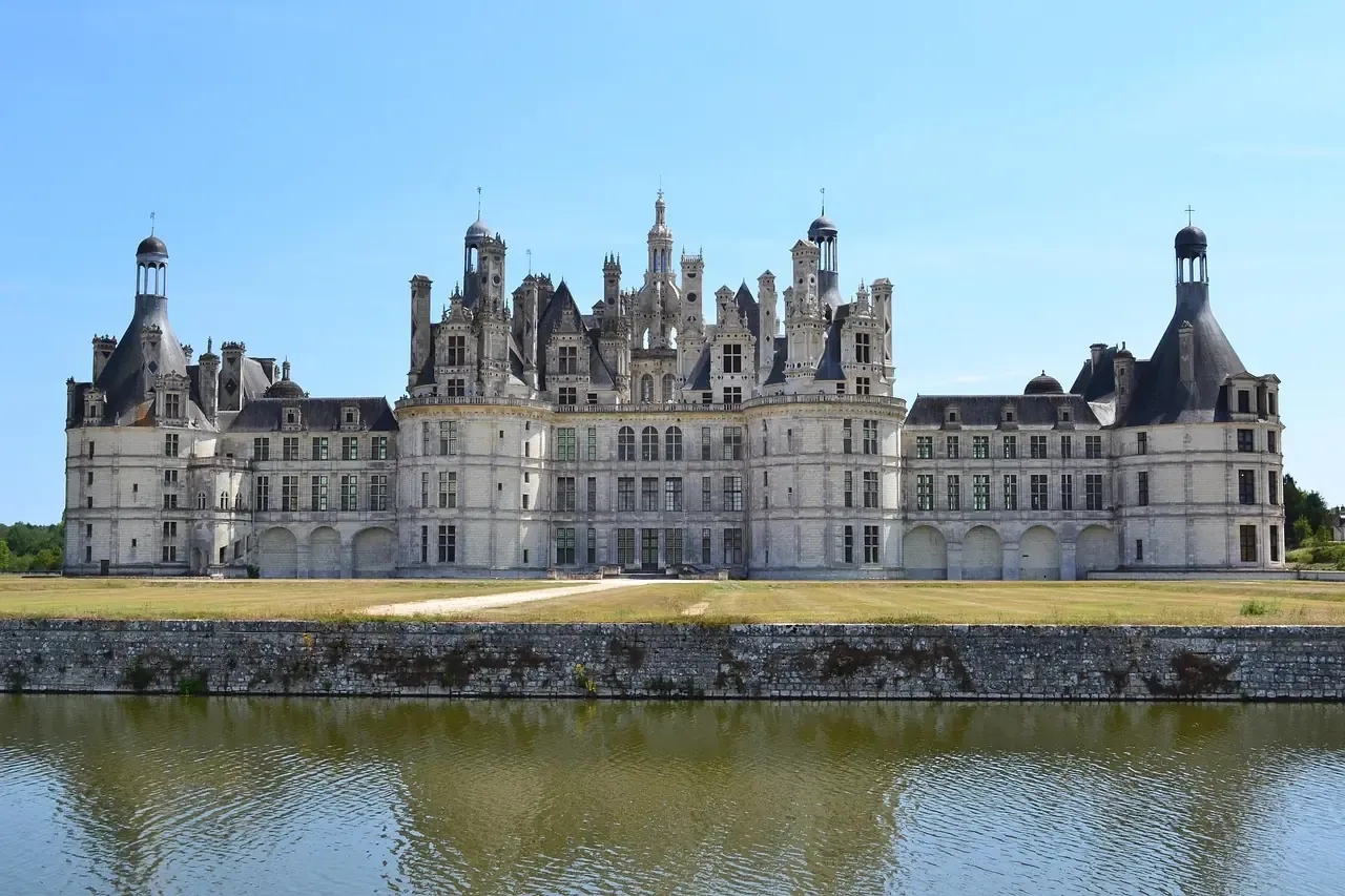The Chateau de Chambord reflected in the Cosson river, Loir-et-Cher, France