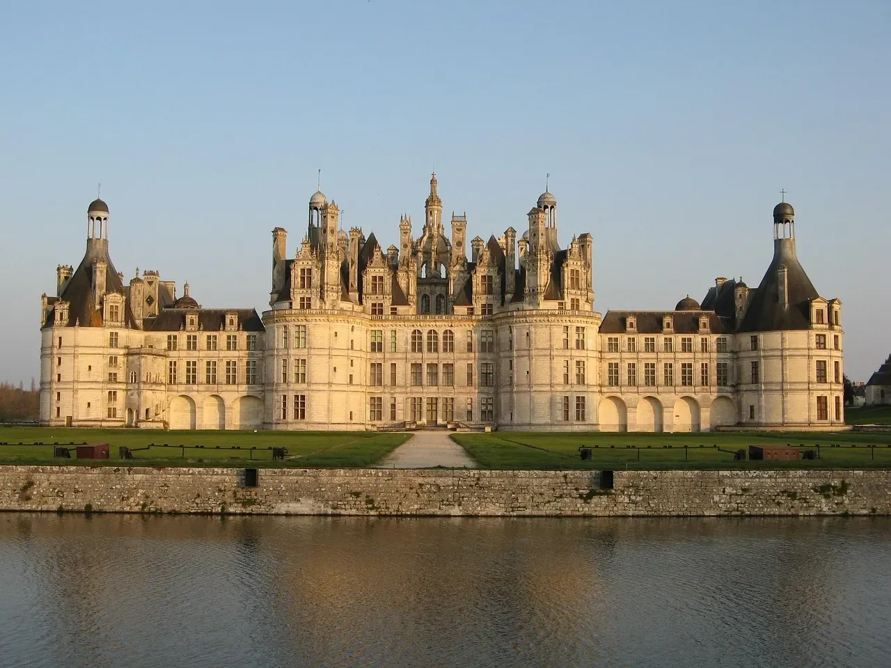 Towers and chimneys of the Chateau de Chambord at golden hour, France