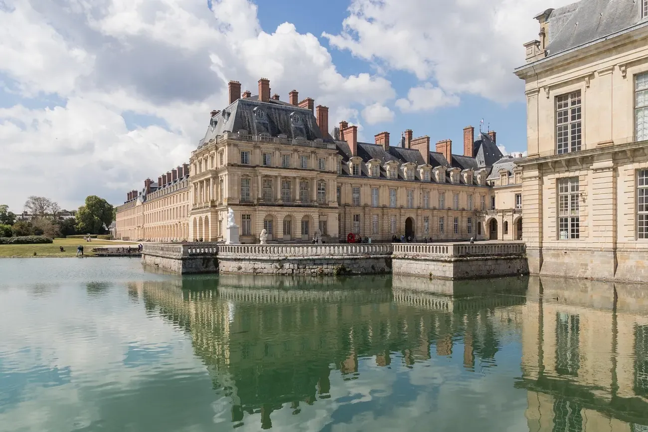 The Chateau de Fontainebleau reflected in its carp pond