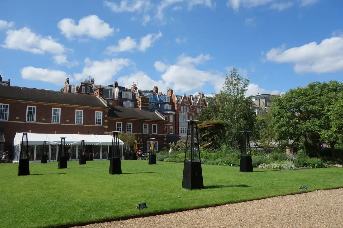 Lawn and historic buildings of Chelsea Physic Garden, London