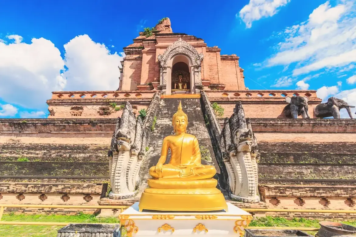 The ancient brick chedi and Buddha image at Wat Chedi Luang in Chiang Mai