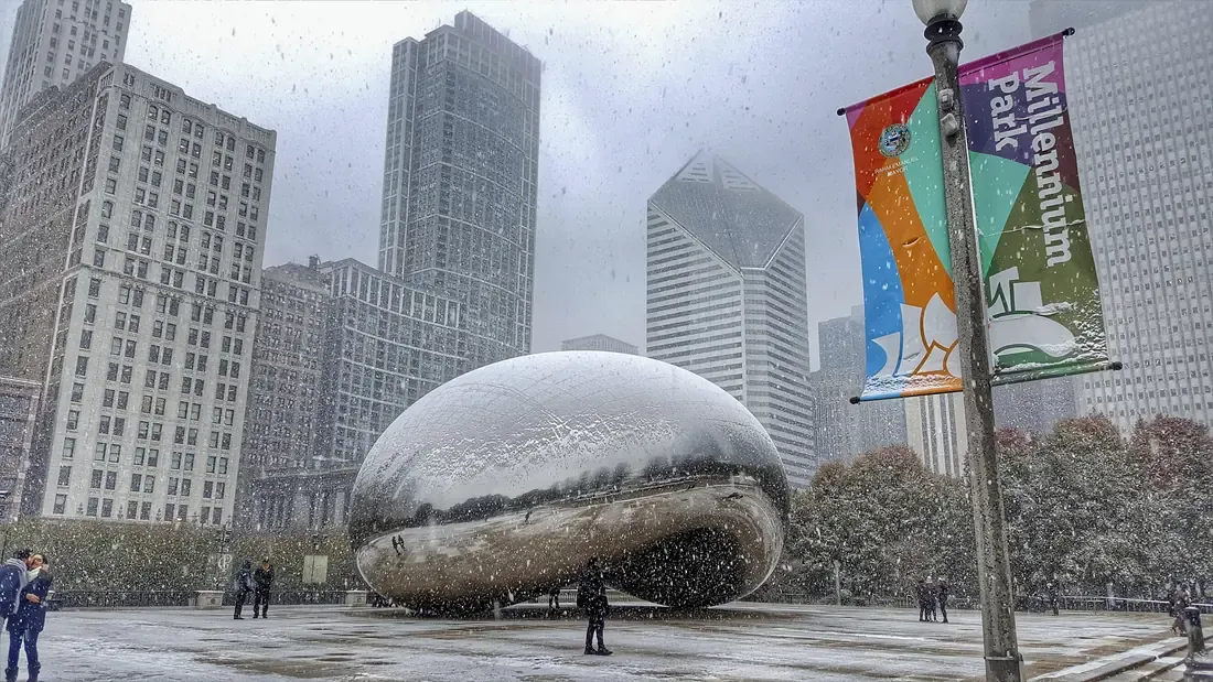 Snow falling on Cloud Gate, the mirrored sculpture in Millennium Park, Chicago