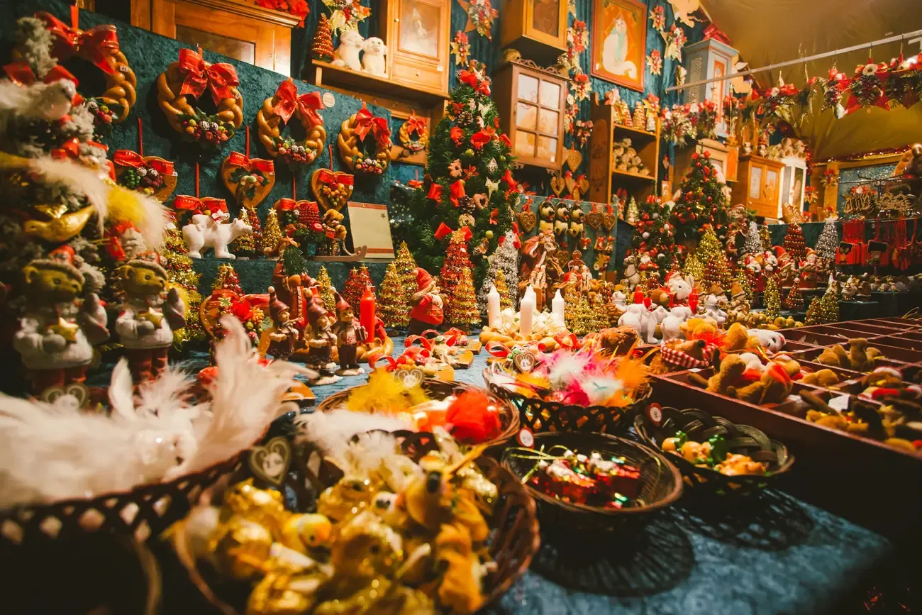 A market stall full of Christmas decorations, wreaths and ornaments near the cathedral in Strasbourg