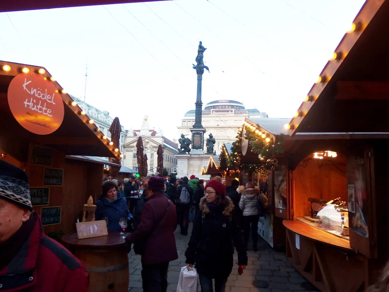Christmas market huts on Am Hof square with the Marian column, Vienna