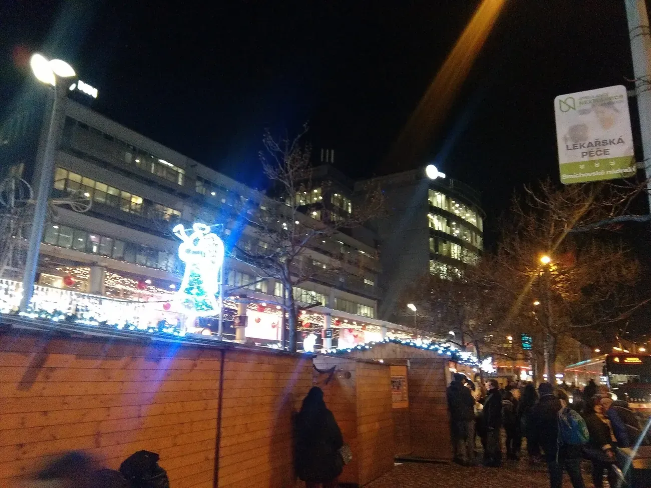 Wooden Christmas market huts and a lit angel figure at Anděl, Smíchov, Prague