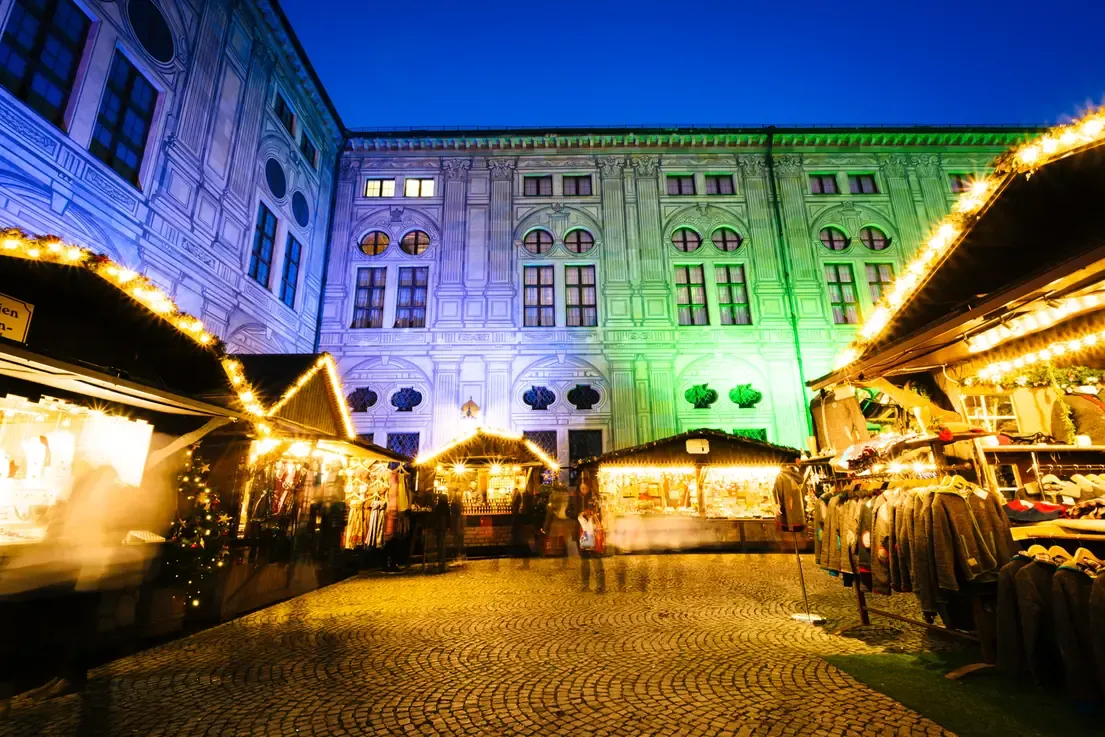 Christmas market at night in front of the Munich Residenz
