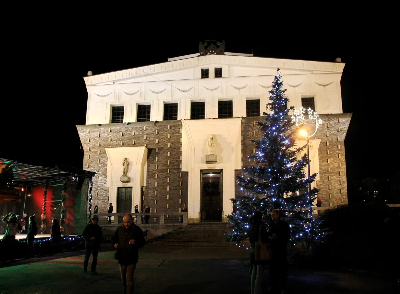 Christmas tree in front of the Church of the Most Sacred Heart of Our Lord on Jiřího z Poděbrad Square at night, Prague